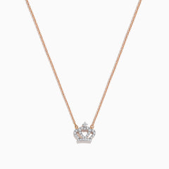 The Novelty 14K Rose Gold Diamond Crown Necklace features a delicate chain and crown-shaped pendant adorned with small sparkling stones, a heart motif at the center, and a single larger stone at the top.