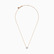 The Novelty 14K Rose Gold Diamond Crown Necklace features a delicate chain and crown-shaped pendant adorned with small sparkling stones, a heart motif at the center, and a single larger stone at the top.
