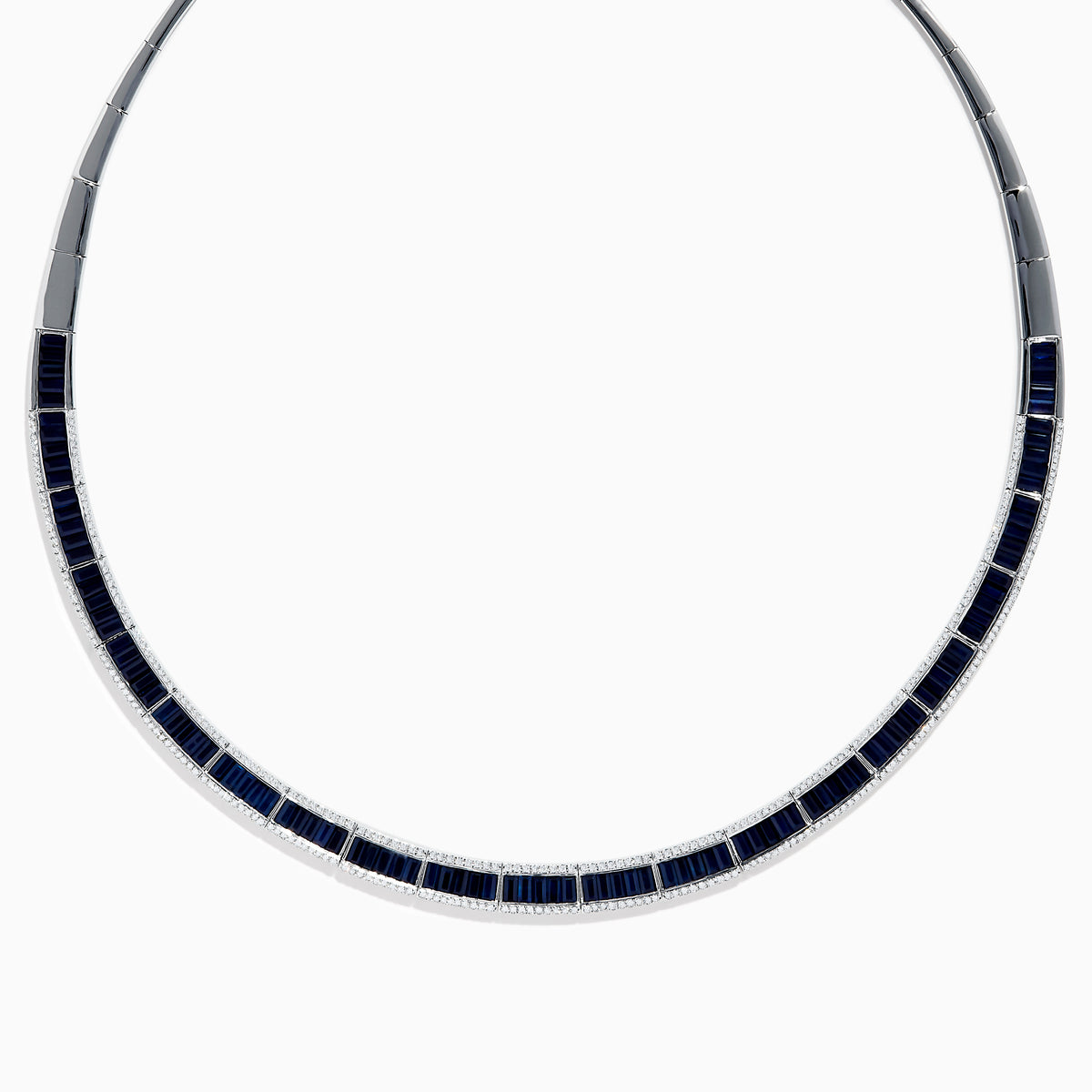 The Royale Bleu 14K White Gold Blue Sapphire and Diamond Necklace features rectangular blue sapphires in a row, bordered by sparkling diamonds in a semi-rigid collar design.