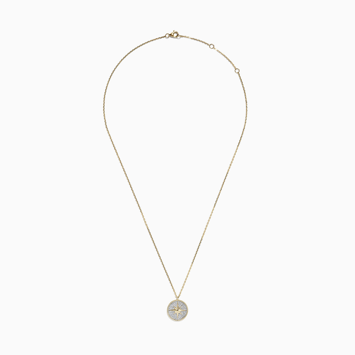 The Novelty 14k Yellow Gold Diamond Compass Pendant features a round star design on a textured silver-tone background, accented with a beaded gold border, and displayed on a plain white background.