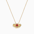The Ruby Royale 14K Yellow Gold Diamond and Ruby Bee Necklace features a bee pendant adorned with red rubies and clear diamonds, elegantly displayed against a white background.