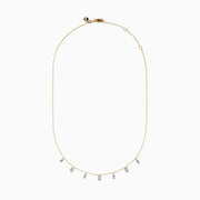 The 14K Two Tone Gold Dangling Diamonds Necklace features seven dainty rectangular diamond pendants evenly spaced along a 14K gold chain, each set with sparkling diamonds. Displayed against a white background.