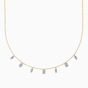 The 14K Two Tone Gold Dangling Diamonds Necklace features seven dainty rectangular diamond pendants evenly spaced along a 14K gold chain, each set with sparkling diamonds. Displayed against a white background.