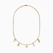 The Seaside 14K Yellow Gold Diamond Charm Necklace by Effy features five nautical charms—dolphin, sailboat, starfish, anchor, and seahorse—with some accented by sparkling diamonds for added shimmer.