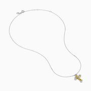 The 14K White Gold Yellow and White Diamond Cross Necklace features a white gold cross pendant with yellow and white diamonds, hanging from a matching chain.