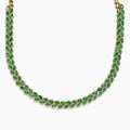 The 14K White Gold Emerald and Diamond Marquise Leaf Necklace features alternating green emeralds and white diamonds in a woven leaf pattern, elegantly displayed against a white background.