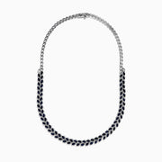 The 14K White Gold Blue Sapphire and Diamond Leaf Motif Necklace showcases a graceful, leaf-inspired design with alternating rows of blue sapphires and diamond accents for a sparkling, elegant look.