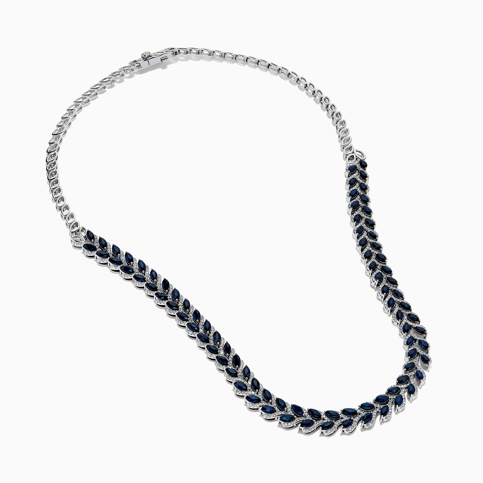 The 14K White Gold Blue Sapphire and Diamond Leaf Motif Necklace showcases a graceful, leaf-inspired design with alternating rows of blue sapphires and diamond accents for a sparkling, elegant look.
