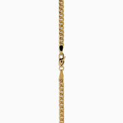 The Signature 14K Yellow Gold Diamond and Tsavorite Panther Necklace features two panther heads with tsavorite green eyes and diamond accents, each biting interlocking diamond-encrusted rings at the center.