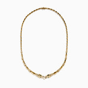 The Signature 14K Yellow Gold Diamond and Tsavorite Panther Necklace features angular links and two detailed panther head motifs with tsavorite eyes and diamond accents at the center, facing each other to form the clasp.