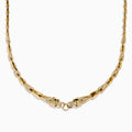 The Signature 14K Yellow Gold Diamond and Tsavorite Panther Necklace features angular links and two detailed panther head motifs with tsavorite eyes and diamond accents at the center, facing each other to form the clasp.