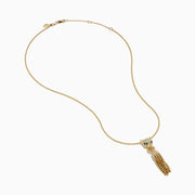 The Web Exclusive 14K Yellow Gold Diamond and Emerald Lariat Tassel Panther Pendant features a diamond-encrusted panther head with emerald eyes, holding a sparkling ring and gold beaded tassels below.