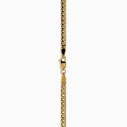 The Signature 14K Yellow Gold Diamond Panther Cuban Chain Necklace features a diamond panther clasp with sparkling stones and green gemstone eyes at the center bottom.