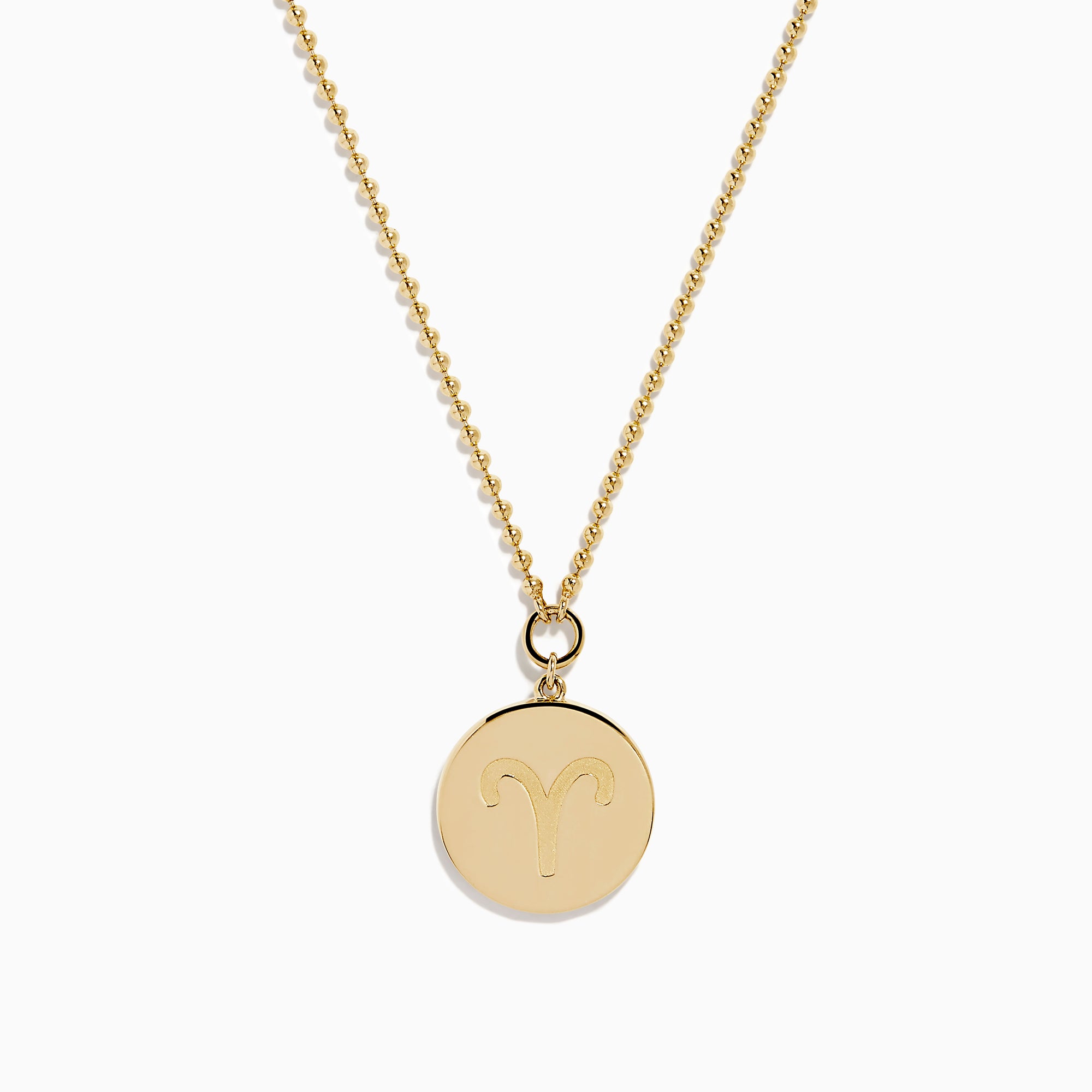 The Zodiac 14K Yellow Gold and Diamond Aries Necklace features a round pendant with an embossed ram, accented by sparkling diamonds, hanging from a delicate gold chain against a white background.