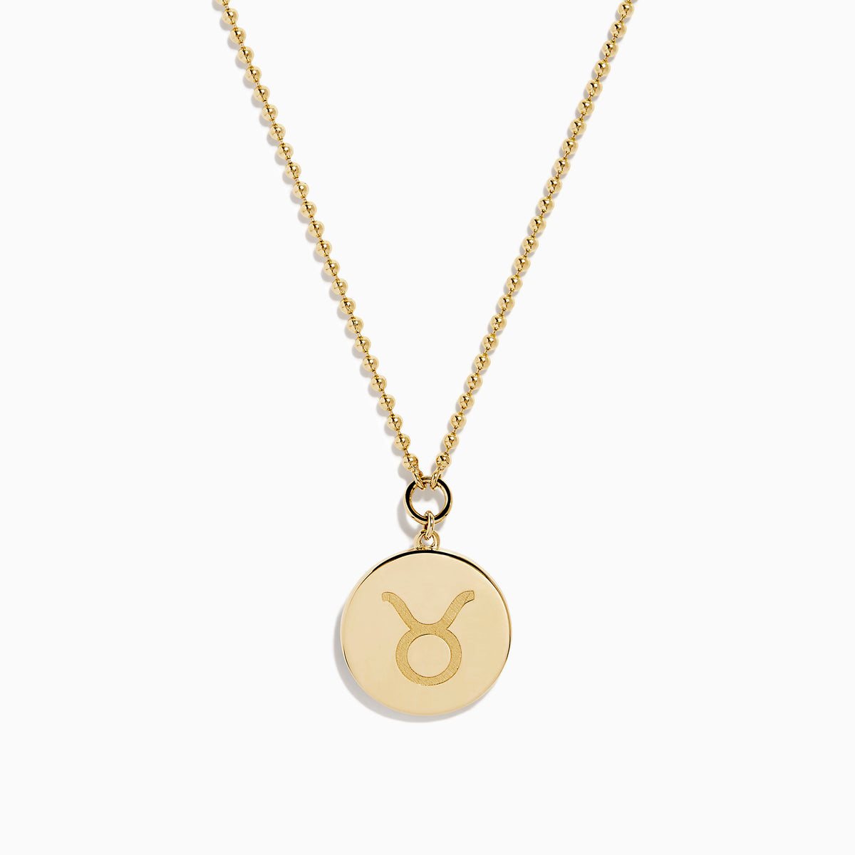 The Zodiac 14K Yellow Gold and Diamond Taurus Necklace features a round pendant with an engraved fish design, accented by diamonds, and hangs from a delicate gold chain on a white background.