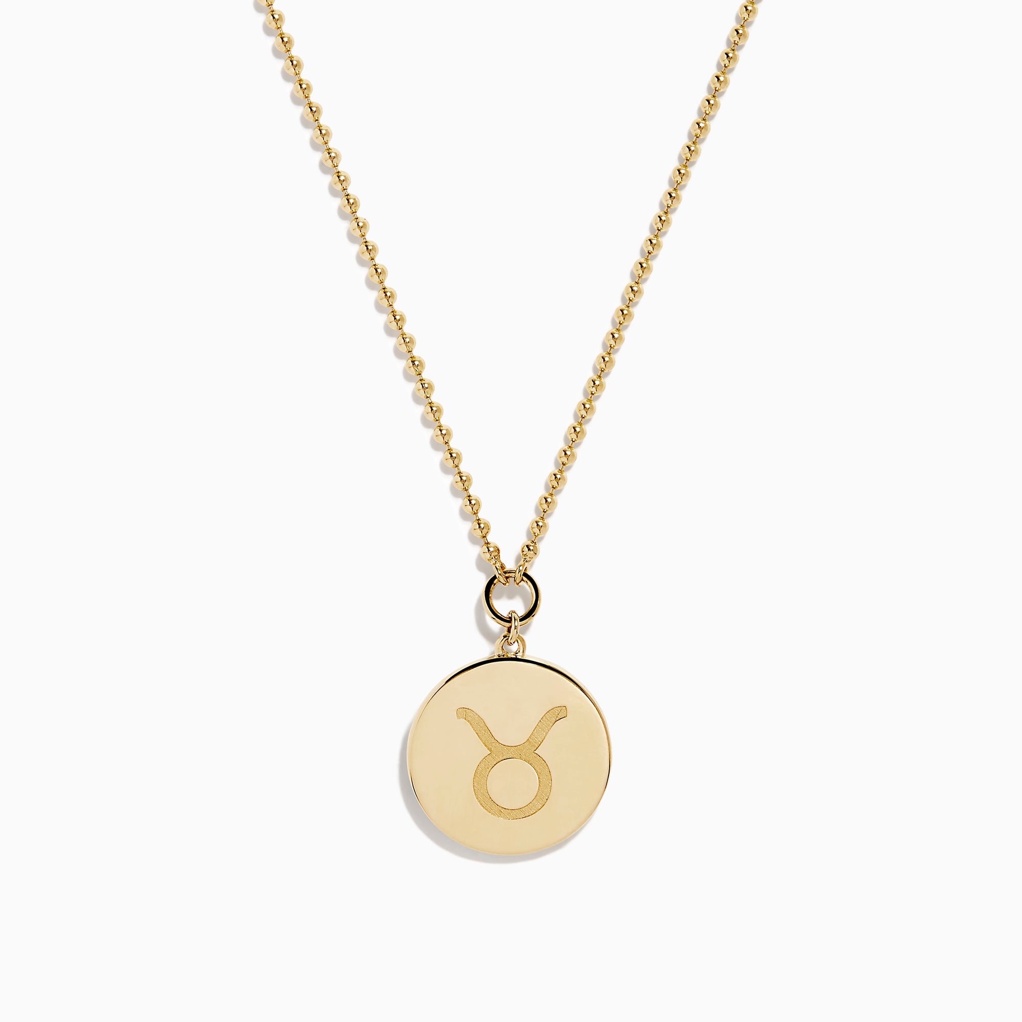 The Zodiac 14K Yellow Gold and Diamond Taurus Necklace features a round pendant with an engraved fish design, accented by diamonds, and hangs from a delicate gold chain on a white background.