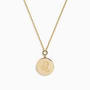 The Zodiac 14K Yellow Gold and Diamond Leo Necklace features a round pendant with an embossed lion design, bordered by sparkling diamonds on a delicate gold chain—an ideal statement piece for any Leo.