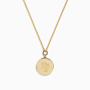 The Zodiac 14K Yellow Gold and Diamond Virgo Necklace features a round pendant with an engraved figure holding a star, accented by sparkling diamonds, shown on a plain white background.