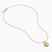 The Zodiac 14K Yellow Gold and Diamond Virgo Necklace features a round pendant with an engraved figure holding a star, accented by sparkling diamonds, shown on a plain white background.