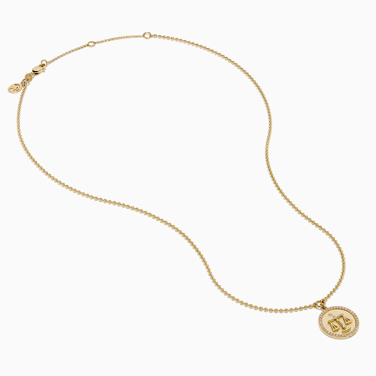 The Zodiac 14K Yellow Gold and Diamond Libra Necklace features a round pendant engraved with the scales of justice, surrounded by sparkling stones for a stunning astrological statement.