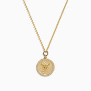 The Zodiac 14K Yellow Gold and Diamond Scorpio Necklace features a round pendant with an ornate Scorpio symbol bordered by sparkling diamonds.