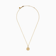 The Zodiac 14K Yellow Gold and Diamond Sagittarius Necklace features a round unicorn pendant with diamond accents on the edge, hanging from a simple gold chain—perfect as a unique zodiac necklace for everyday wear.