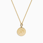 The Zodiac 14K Yellow Gold and Diamond Sagittarius Necklace features a round unicorn pendant with diamond accents on the edge, hanging from a simple gold chain—perfect as a unique zodiac necklace for everyday wear.