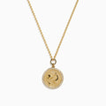 The Zodiac 14K Yellow Gold and Diamond Pisces Necklace features a circular pendant with two embossed dolphins symbolizing Pisces, surrounded by sparkling diamonds for added elegance.