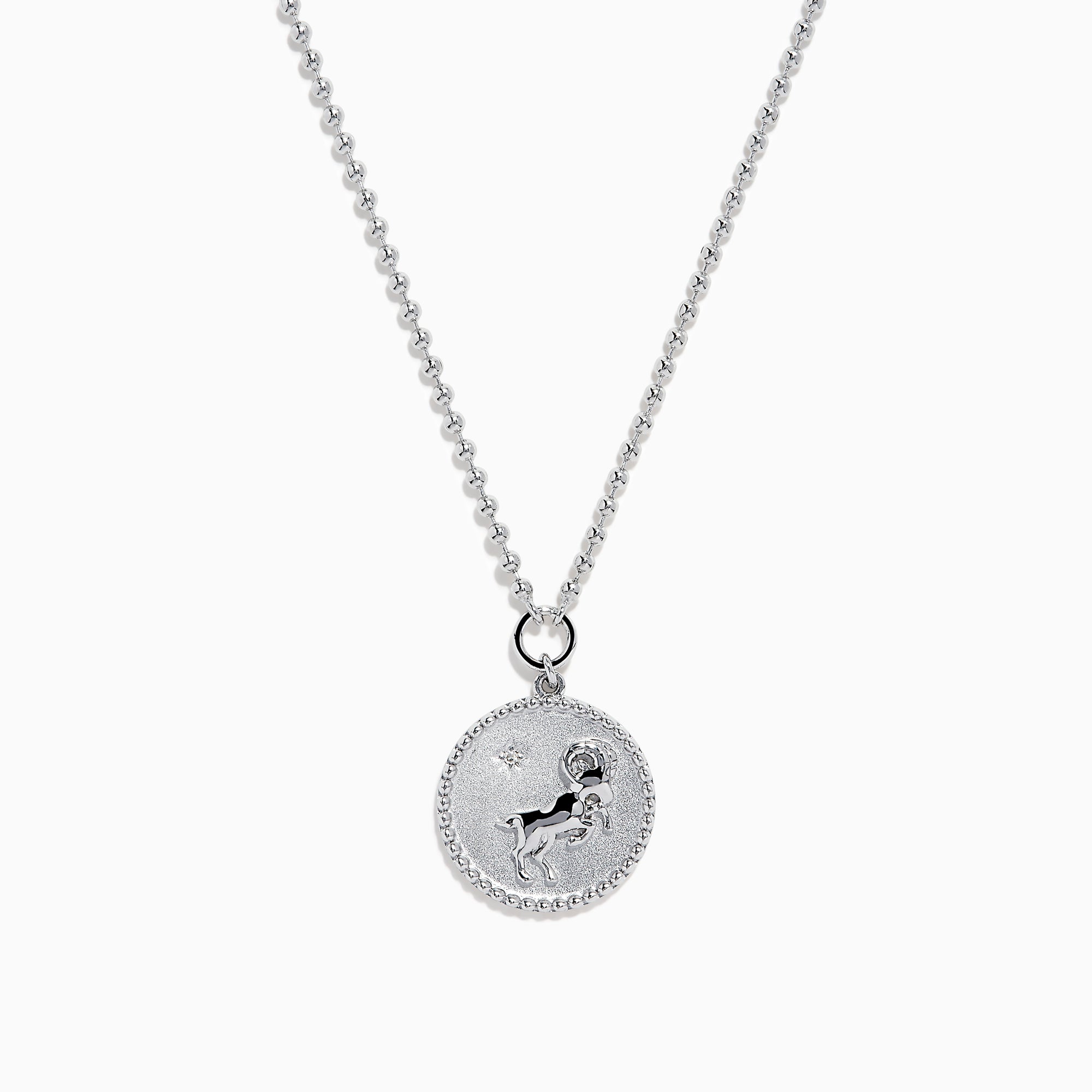 The Zodiac 925 Sterling Silver and Diamond Aries Necklace features a round sterling silver pendant with a textured edge, engraved Aries design, and hangs from a beaded chain.