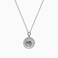 The Zodiac 925 Sterling Silver and Diamond Taurus Necklace features a round pendant with a raised bull design in the center, symbolizing Taurus, and is accented by a beaded edge.