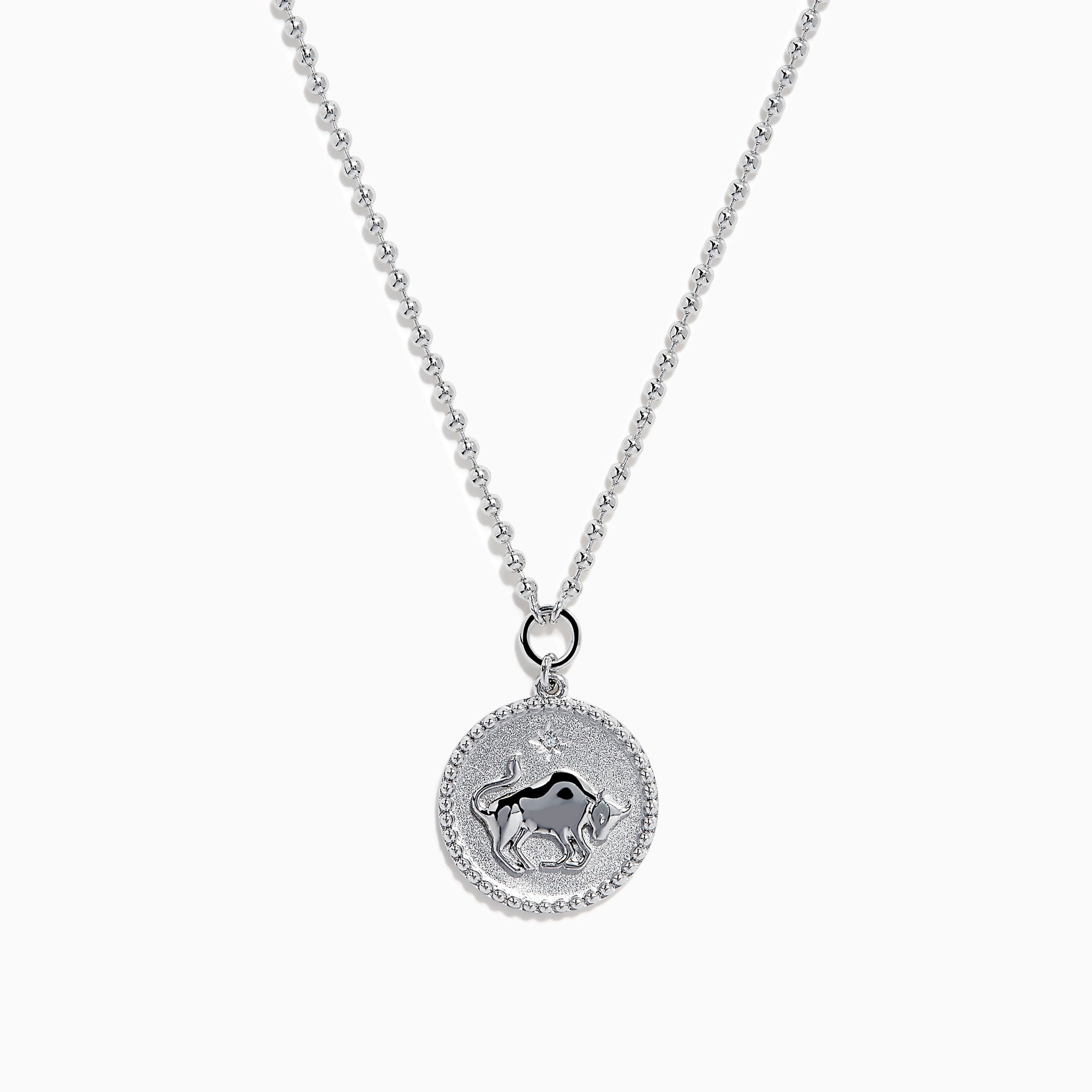The Zodiac 925 Sterling Silver and Diamond Taurus Necklace features a round pendant with a raised bull design in the center, symbolizing Taurus, and is accented by a beaded edge.
