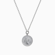The Zodiac 925 Sterling Silver and Diamond Virgo Necklace features a round sterling silver pendant with a Virgo engraving, suspended on a beaded chain and shown against a white background.