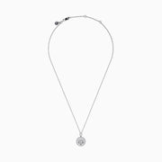 The Zodiac 925 Sterling Silver and Diamond Libra Necklace showcases a round pendant with engraved scales of justice, symbolizing Libra, suspended from a beaded chain.