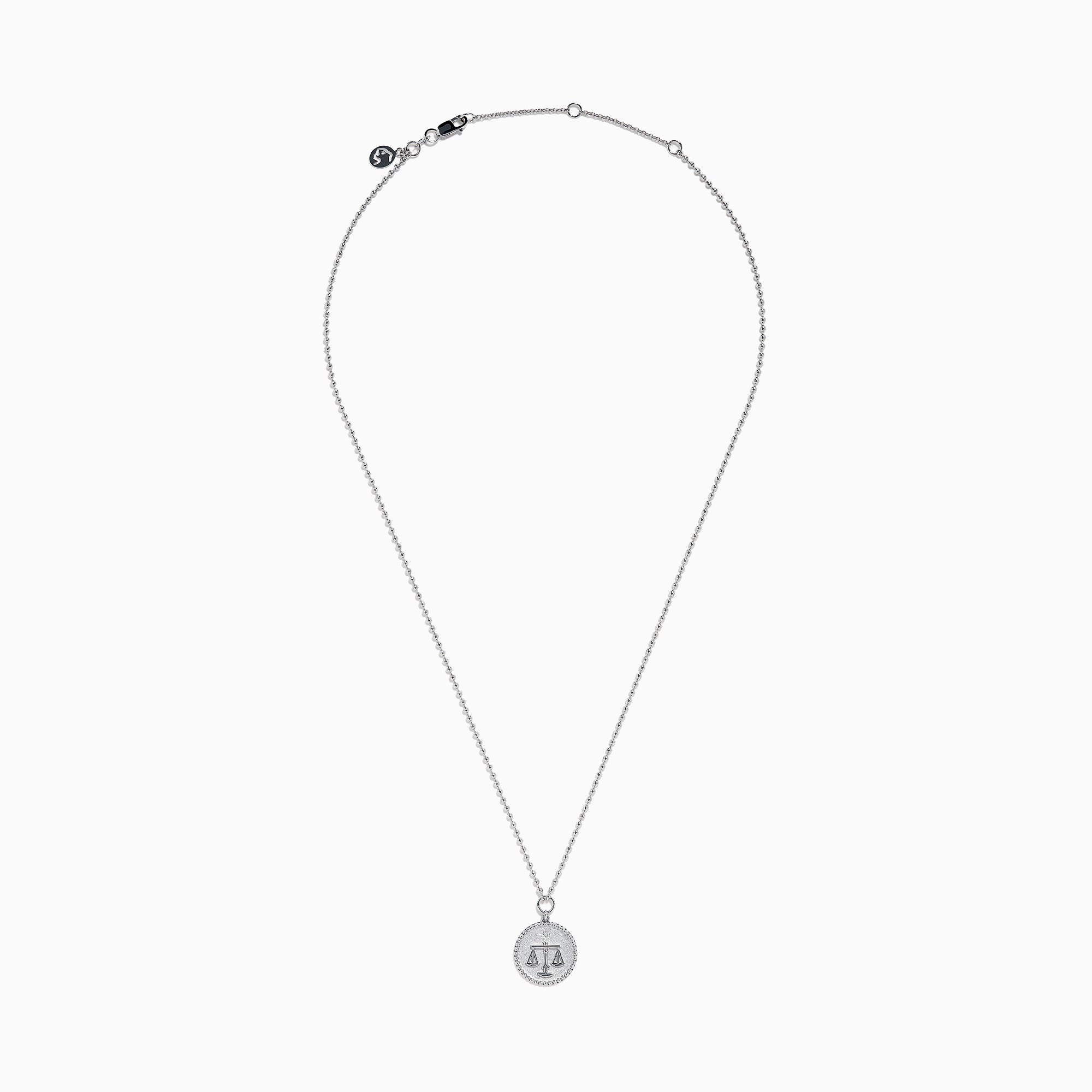 The Zodiac 925 Sterling Silver and Diamond Libra Necklace showcases a round pendant with engraved scales of justice, symbolizing Libra, suspended from a beaded chain.