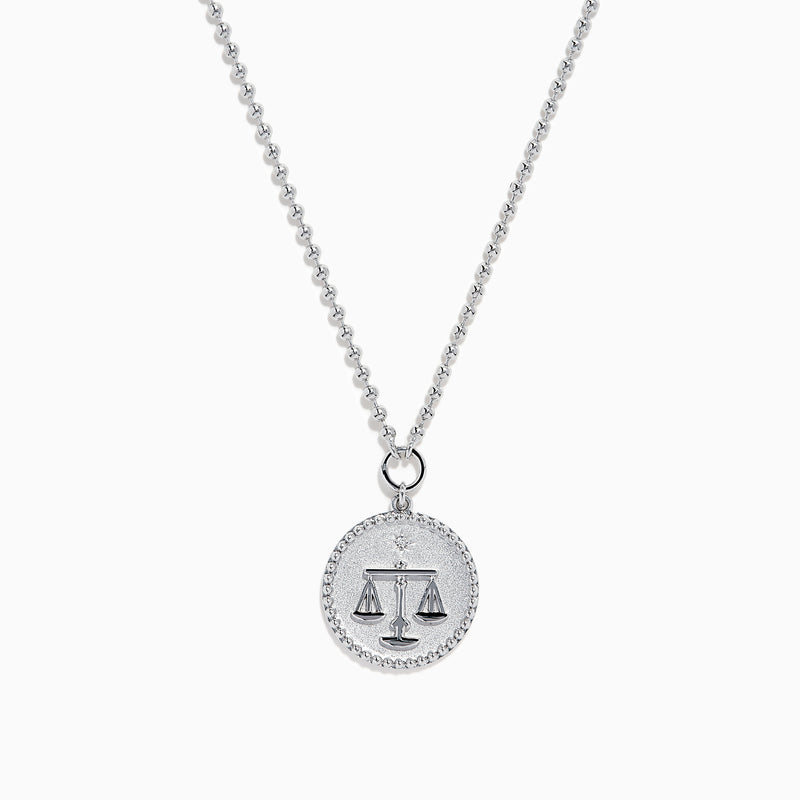 The Zodiac 925 Sterling Silver and Diamond Libra Necklace showcases a round pendant with engraved scales of justice, symbolizing Libra, suspended from a beaded chain.