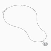 The Zodiac 925 Sterling Silver and Diamond Libra Necklace showcases a round pendant with engraved scales of justice, symbolizing Libra, suspended from a beaded chain.