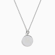 The Zodiac 925 Sterling Silver and Diamond Scorpio Necklace features a round, textured pendant with an engraved scorpion design, hanging from a beaded chain against a white background.