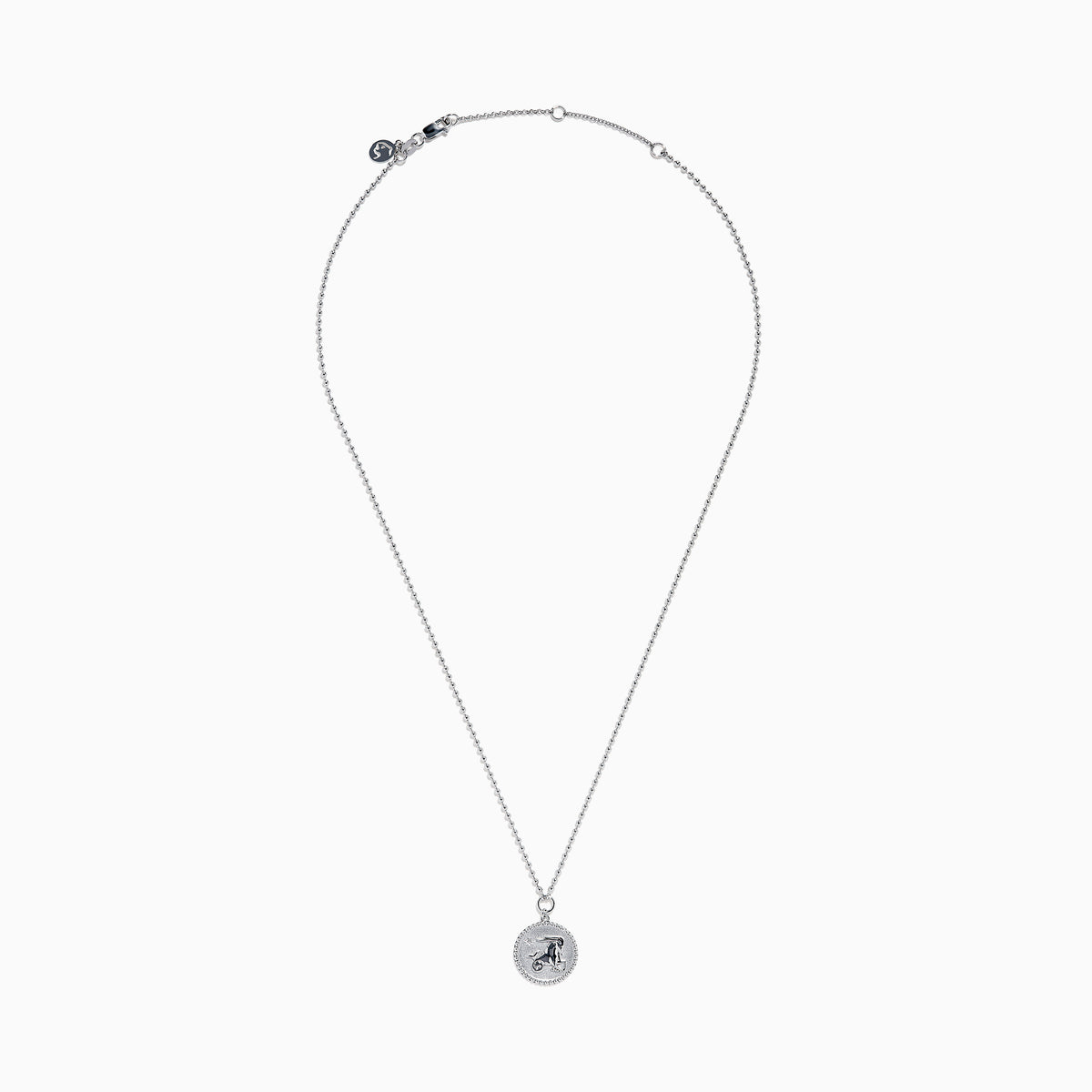 The Zodiac 925 Sterling Silver and Diamond Capricorn Necklace features a round, textured pendant engraved with a figure playing soccer, offering a unique twist on the classic Zodiac style. Shown against a plain white background.