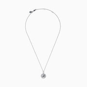 The Zodiac 925 Sterling Silver and Diamond Capricorn Necklace features a round, textured pendant engraved with a figure playing soccer, offering a unique twist on the classic Zodiac style. Shown against a plain white background.