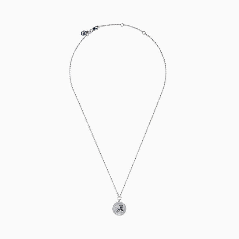 The Zodiac 925 Sterling Silver and Diamond Capricorn Necklace features a round, textured pendant engraved with a figure playing soccer, offering a unique twist on the classic Zodiac style. Shown against a plain white background.
