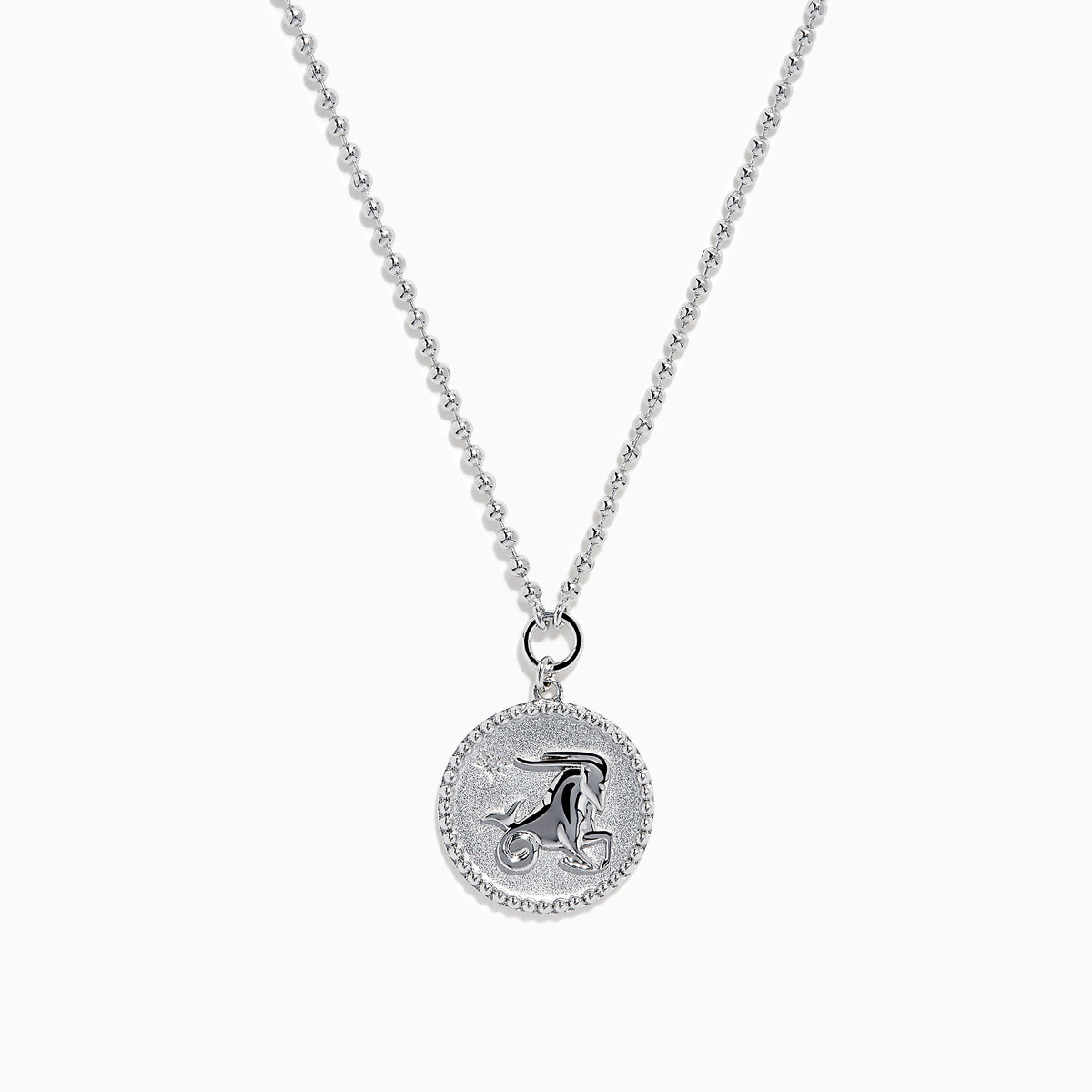The Zodiac 925 Sterling Silver and Diamond Capricorn Necklace features a round, textured pendant engraved with a figure playing soccer, offering a unique twist on the classic Zodiac style. Shown against a plain white background.