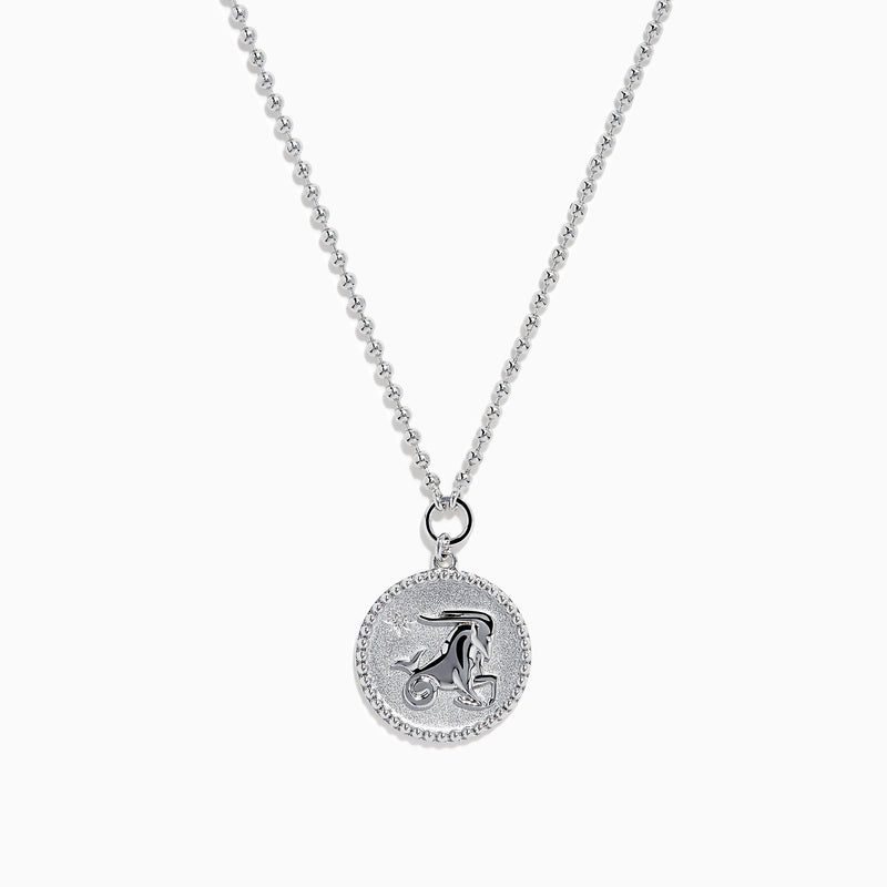 The Zodiac 925 Sterling Silver and Diamond Capricorn Necklace features a round, textured pendant engraved with a figure playing soccer, offering a unique twist on the classic Zodiac style. Shown against a plain white background.