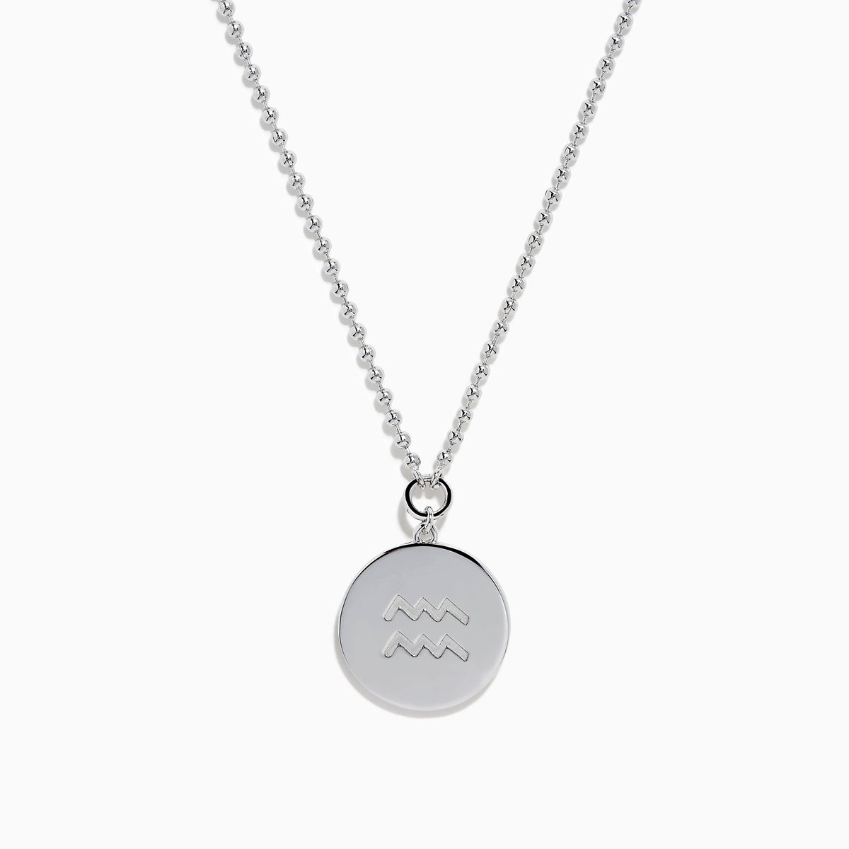 The Zodiac 925 Sterling Silver and Diamond Aquarius Necklace features a round, textured pendant engraved with a kneeling figure in prayer, offering a subtle yet meaningful tribute to the Aquarius sign.