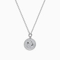 The Zodiac 925 Sterling Silver and Diamond Pisces Necklace features a beaded chain and a round pendant engraved with two dolphins, shown against a white background.