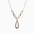The 14K Rose Gold Brown and White Diamond Necklace features interlocking teardrop and marquise-shaped links set with sparkling brown and white diamonds for an elegant, intricate look.