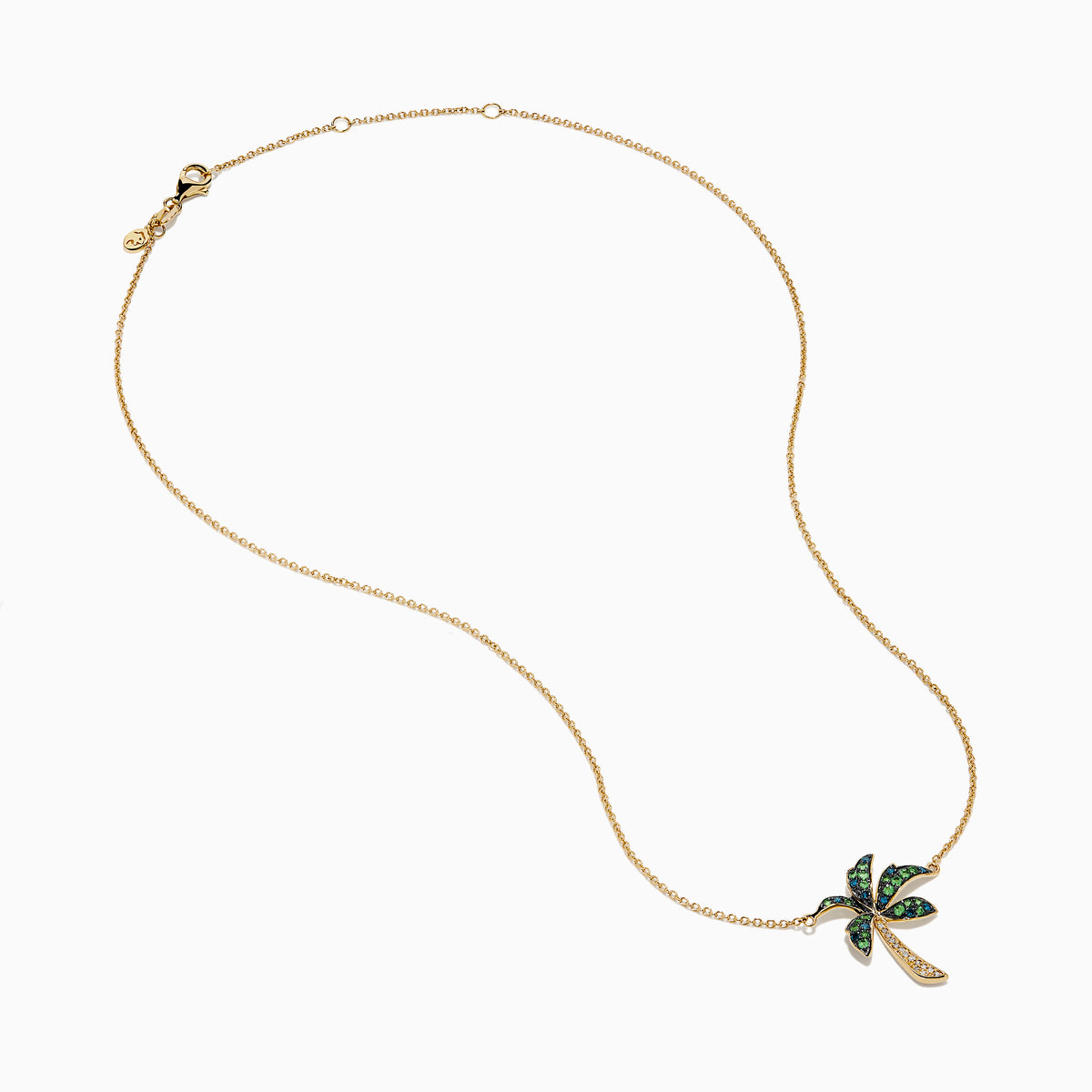 The 14K Yellow Gold Tsavorite and Diamond Palm Tree Pendant features green tsavorite and diamond accents on a simple gold chain, shown on a white background.