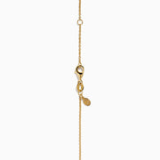 The 14K Yellow Gold Tsavorite and Diamond Palm Tree Pendant features green tsavorite and diamond accents on a simple gold chain, shown on a white background.