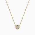 The DOro 14K Yellow Gold Diamond Necklace features a delicate gold chain and a round pendant with a cluster of sparkling diamonds at the center.