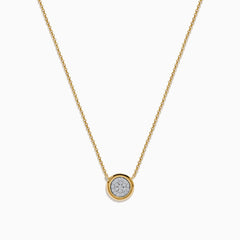 The DOro 14K Yellow Gold Diamond Necklace features a delicate gold chain and a round pendant with a cluster of sparkling diamonds at the center.