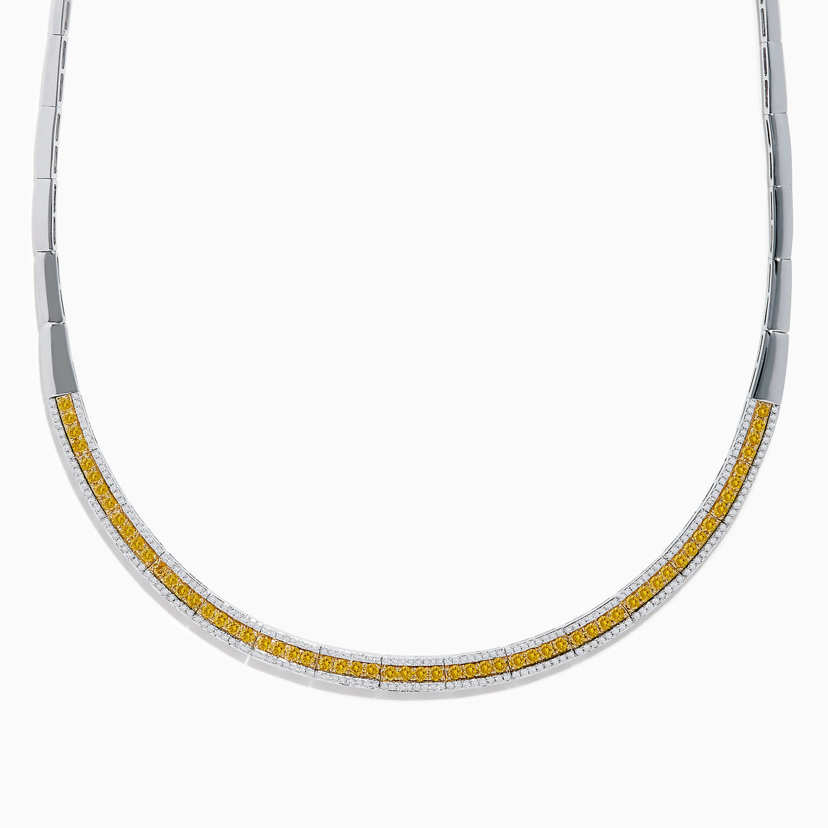 The Canare 14K Two Tone Gold White and Yellow Diamond Necklace features a sleek, curved design accented with a row of sparkling yellow diamonds bordered by slim gold edges.